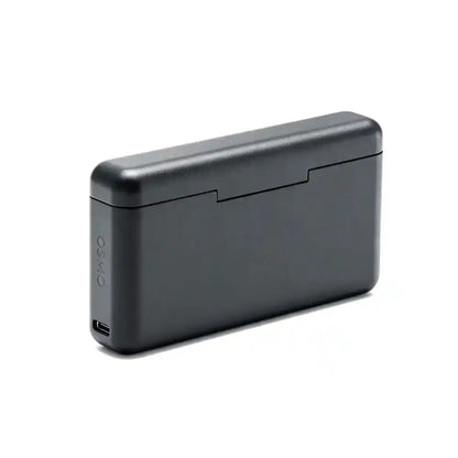 Osmo Action 6 charging case loaded with 3 spare batteries and two microSD cards